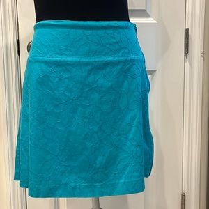 Lady Hagen turquoise golf skort with floral texture, size 12.